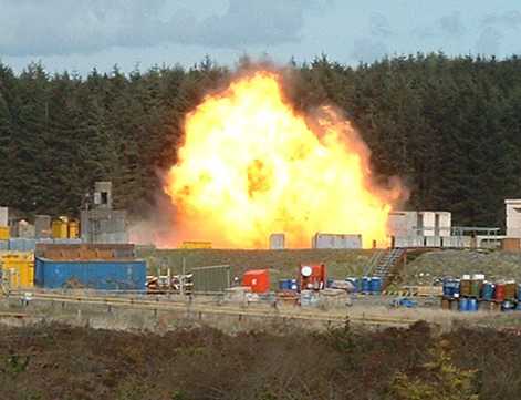 A large explosion at an external trial to test the resistance offered by different types of glass to terrorist attack.
